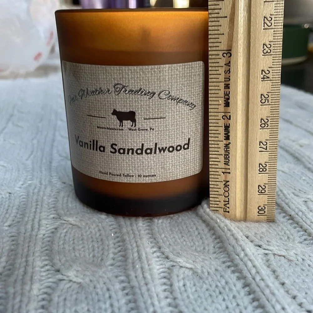 NWOT Vanilla Sandalwood candle. 10 0z. Hand poured amber glass wood lid one wick